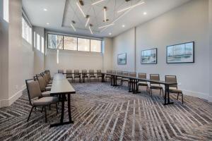 a conference room with a long table and chairs at Embassy Suites By Hilton Asheville Downtown in Asheville