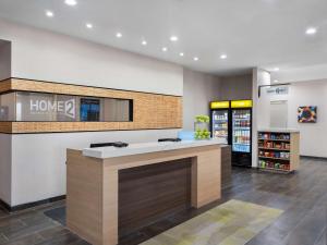 a lobby of a home depot store with a counter at Home2 Suites By Hilton Round Rock Medical Center in Round Rock