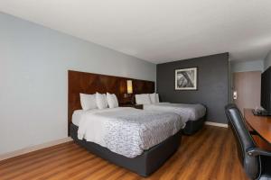 Postel nebo postele na pokoji v ubytování Econo Lodge