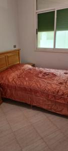 Säng eller sängar i ett rum på Appartement Bni Bouayach