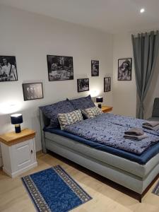 a bedroom with a bed and pictures on the wall at Schinderhannes in Waibstadt