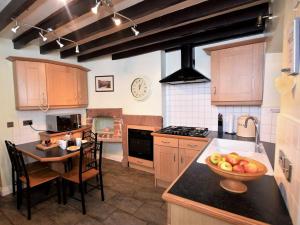 a kitchen with a bowl of fruit on a counter at 3 Bed in Wasdale SZ205 in Santon Bridge