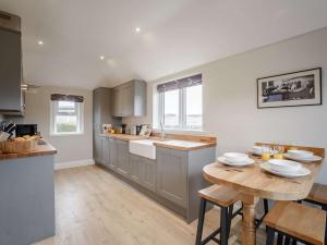 a kitchen with a table and a counter top at 2 Bed in Duns 82759 in Duns