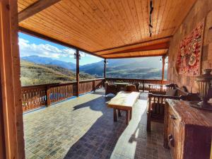 a large balcony with a view of the mountains at Filin Resort in Ijevan