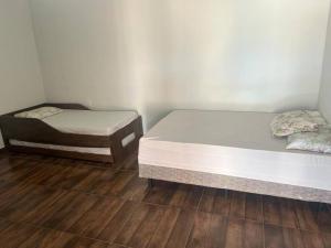 Postel nebo postele na pokoji v ubytování Recanto Olavinho + 6 fotografií