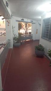 a room with two potted plants in a building at HOTEL VISTA AL MAR habitacion para 6 personas in Rodadero