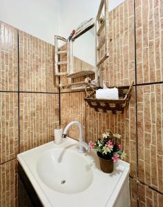 a bathroom with a sink and a mirror at Pousada Praiana Jericoacora in Jericoacoara +52 photos