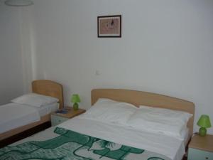 Katil atau katil-katil dalam bilik di Wohnung in Barbat mit Terrasse und Grill