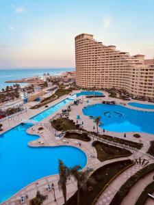 an aerial view of a resort with blue pools at Porto Sokhna Red Sea in Ain Sokhna