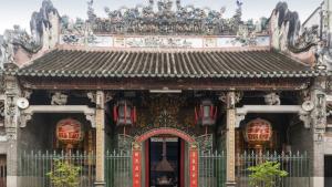 an ornate building with a red door at Mặt Trời Vàng Hotel in Ho Chi Minh City +16 photos