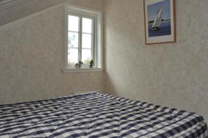 Postel nebo postele na pokoji v ubytování Ferienhaus in Tjörn mit Grill und Garten