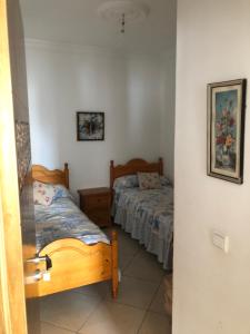 Postel nebo postele na pokoji v ubytování Casa martil 5 min playa