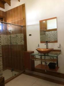 a bathroom with a sink and a shower at Villa Santiago , La Loma de Ranchito Pichey in Santiago de los Caballeros
