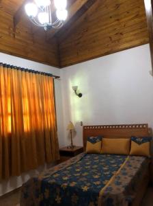 Postel nebo postele na pokoji v ubytování Villa Santiago , La Loma de Ranchito Pichey + 11 fotografií