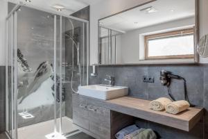 a bathroom with a sink and a shower at Ferienwohnung für 5 Personen ca 65 qm in Sölden, Tirol Skigebiet Sölden in Sölden