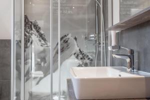a bathroom with a sink and a shower at Ferienwohnung für 5 Personen ca 65 qm in Sölden, Tirol Skigebiet Sölden in Sölden