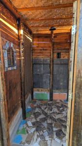 an inside view of a room with a broken floor at La Window Glamping in La Ventana