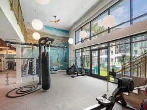 a fitness room with a gym with tread machines at Huge 2bd Apt Near Disneyland and Anaheim Conv Center in Santa Ana