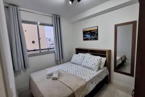 Postel nebo postele na pokoji v ubytování Seu lindo lar no centro Carioca