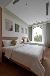Postel nebo postele na pokoji v ubytování Hotel Ocean Homes + 37 fotografií