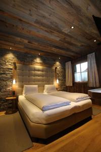 En eller flere senge i et værelse på Komfortables Ferienhaus in Flachau mit Garten, Grill und Sauna und Panoramablick