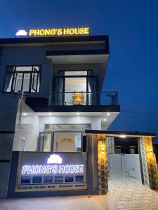 a philippines house with a sign in front of it at PHONG'S HOUSE in Cu Lao Thu