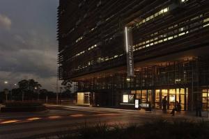a large building with a lot of windows at night at Apartment nestled between Lake Burley Griffin, city and ANU in Canberra +6 photos
