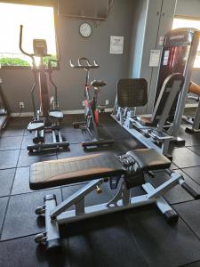 a gym with several exercise bikes in a room at BEACH FLAT in Salvador