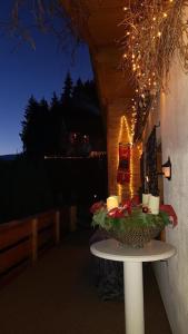 a table with candles and lights on a patio at Ferienhaus für 2 Personen ca 70 qm in Wolfsberg, Kärnten Saualpe in Wolfsberg