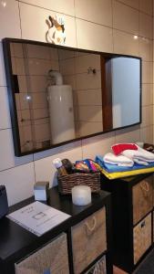 a bathroom with a mirror and a table with towels at Ferienhaus für 2 Personen ca 70 qm in Wolfsberg, Kärnten Saualpe in Wolfsberg