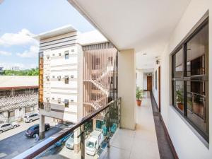 a balcony with a view of a building at MCA Suites by Hiverooms in Cebu City