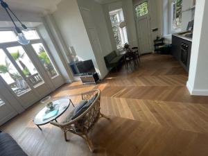a living room with a chair and a table at Apartment in Vignone Villa Setting in Vignone