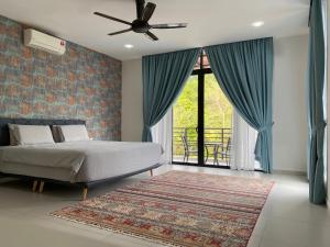 a bedroom with a bed and a large window at Casa al Mare Andaman Hills Villa in Pantai Cenang +54 photos