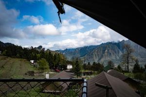 a view of a mountain range from inside a tent at BZIKA Hilltop Tent Hotel in Zhangjiajie