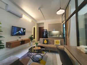 a living room with a couch and a table at Cygnus Homestay Ha Noi 59 in Hanoi