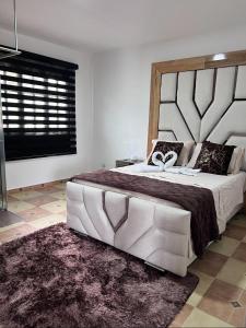 Cama o camas de una habitación en ECO HOTEL LA MILAGROSA