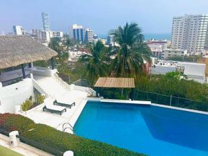 Bazen u ili blizu objekta Moderna casa de 3 dormitorios con cama King size y vistas al horizonte de la piscina