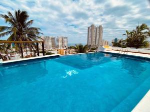Bazen u ili blizu objekta Moderna casa de 3 dormitorios con cama King size y vistas al horizonte de la piscina