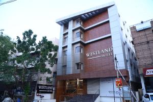 a building with a sign that reads westland hotel at WESTLAND HOTEL- ERODE in Erode