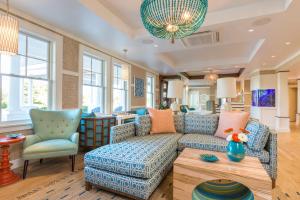 a living room with a couch and a table at The Break Hotel in Narragansett