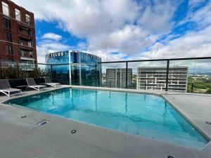 a swimming pool on the roof of a building at Luxury 2 Bedroom apartment with pool in Guatemala