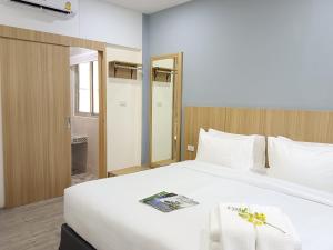 Postel nebo postele na pokoji v ubytování Beyond 21 Hotel