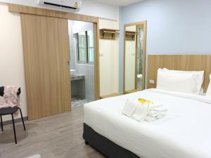 Postel nebo postele na pokoji v ubytování Beyond 21 Hotel