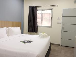 Postel nebo postele na pokoji v ubytování Beyond 21 Hotel