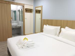 Postel nebo postele na pokoji v ubytování Beyond 21 Hotel