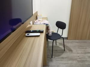 TV a/nebo společenská místnost v ubytování Beyond 21 Hotel
