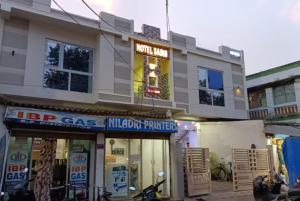 a store with a sign on the side of a building at Hotel Sashi Puri Near Sea Beach & Temple - Best Choice of Travellers in Puri