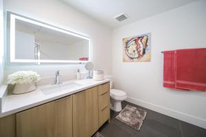 a bathroom with a sink and a toilet at 3 Lux large apartment heart of SM in Los Angeles +29 photos