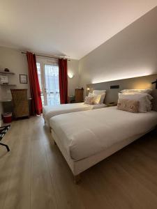 Cama ou camas em um quarto em Castel Fleuri