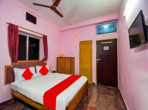 Postelja oz. postelje v sobi nastanitve Hotel Planet 9 Puri - Wonderfull Stay with Family Near Sea Beach